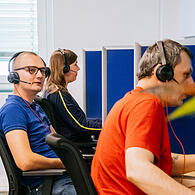 Arbeiten bei SPS Germany in Bamberg: Marcel Pochwalski und Jonathan Franzel kümmern sich täglich im Kundenservice für eine führende Depotbank um Anfragen rund um Depots wie Stammdatenanpassungen und Depoteröffnungen.